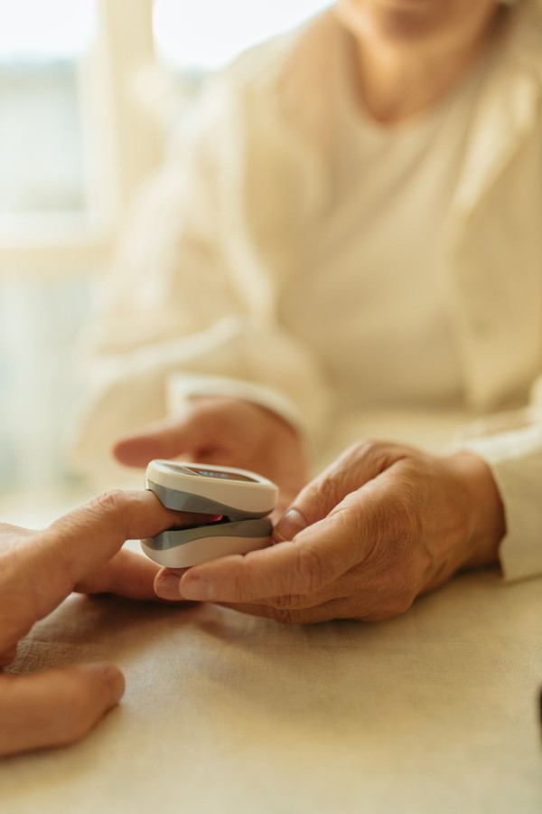 Professional caregiver conducting home check-in with documented protocols